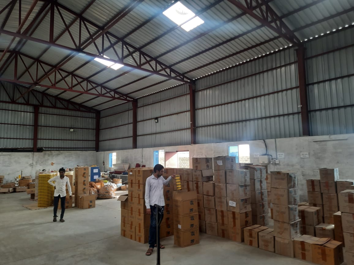 Workers handling adhesive tape production and packing